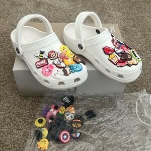 White clogs worn once comes with all decorations size between a 6 and 7